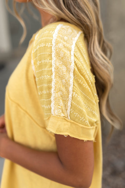 Short sleeve marigold top with fabric on the sleeves