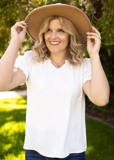 Front view of a short sleeve white top