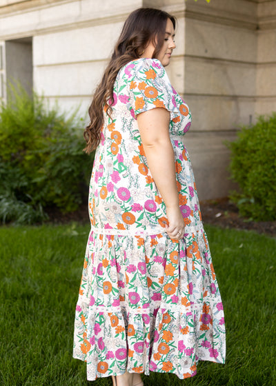 Side view of a tan floral dress