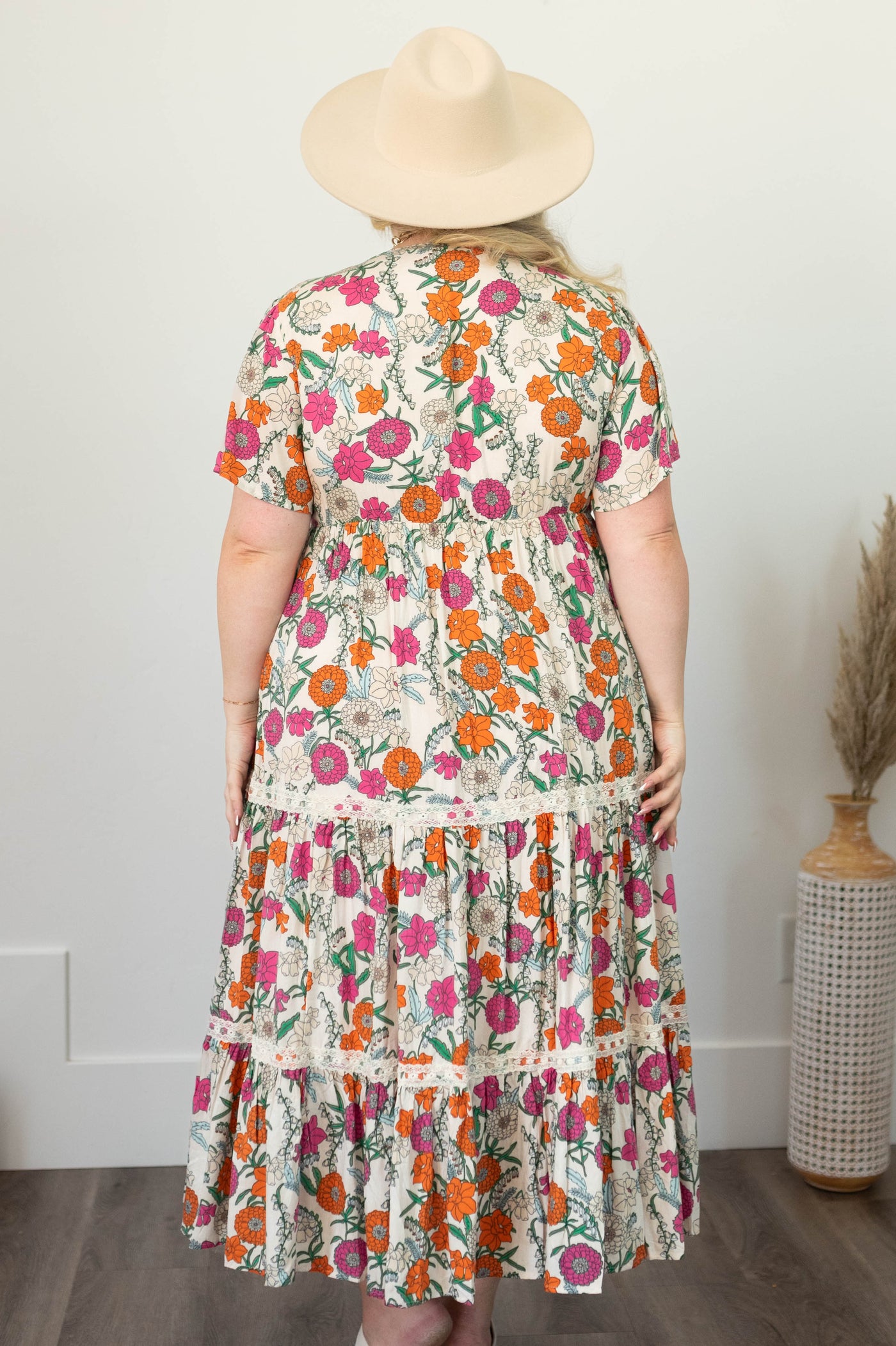 Back view of a tan floral dress