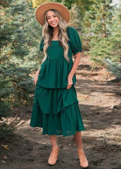 Square neck on a green ruffle tiered dress