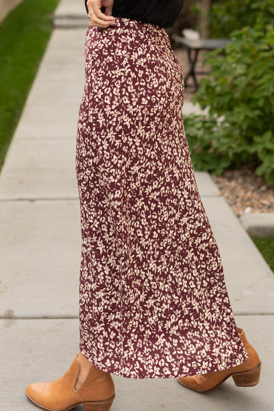 Side view of a merlot floral skirt