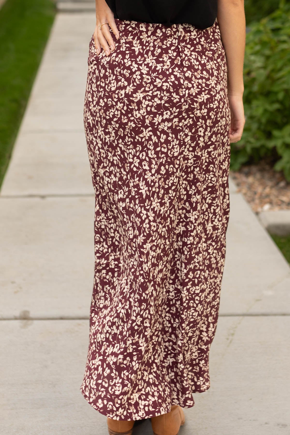 Back view of a merlot floral skirt