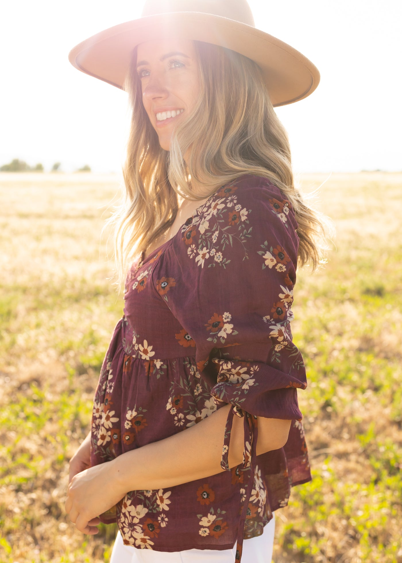 Side view of a plum floral top
