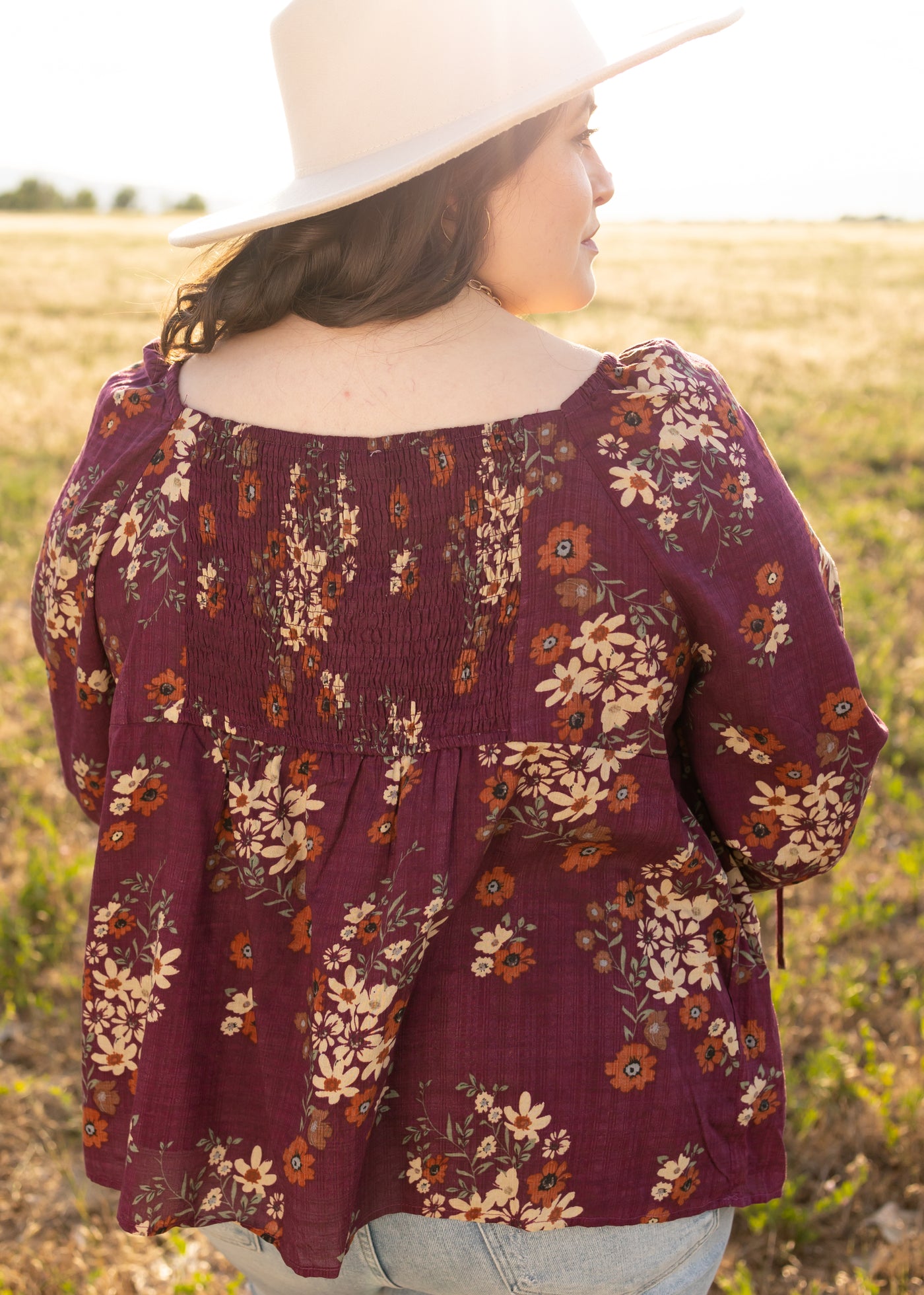Back view of a plus size plum top