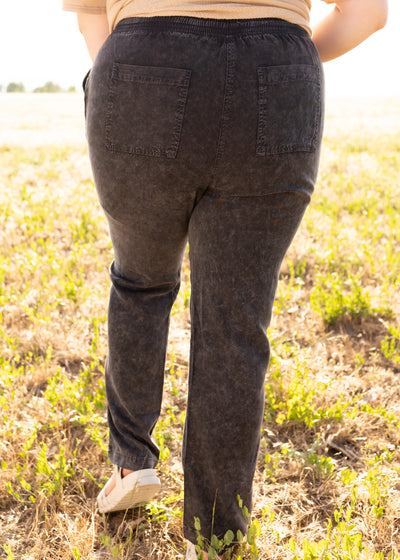 Back view of black pants with pockets