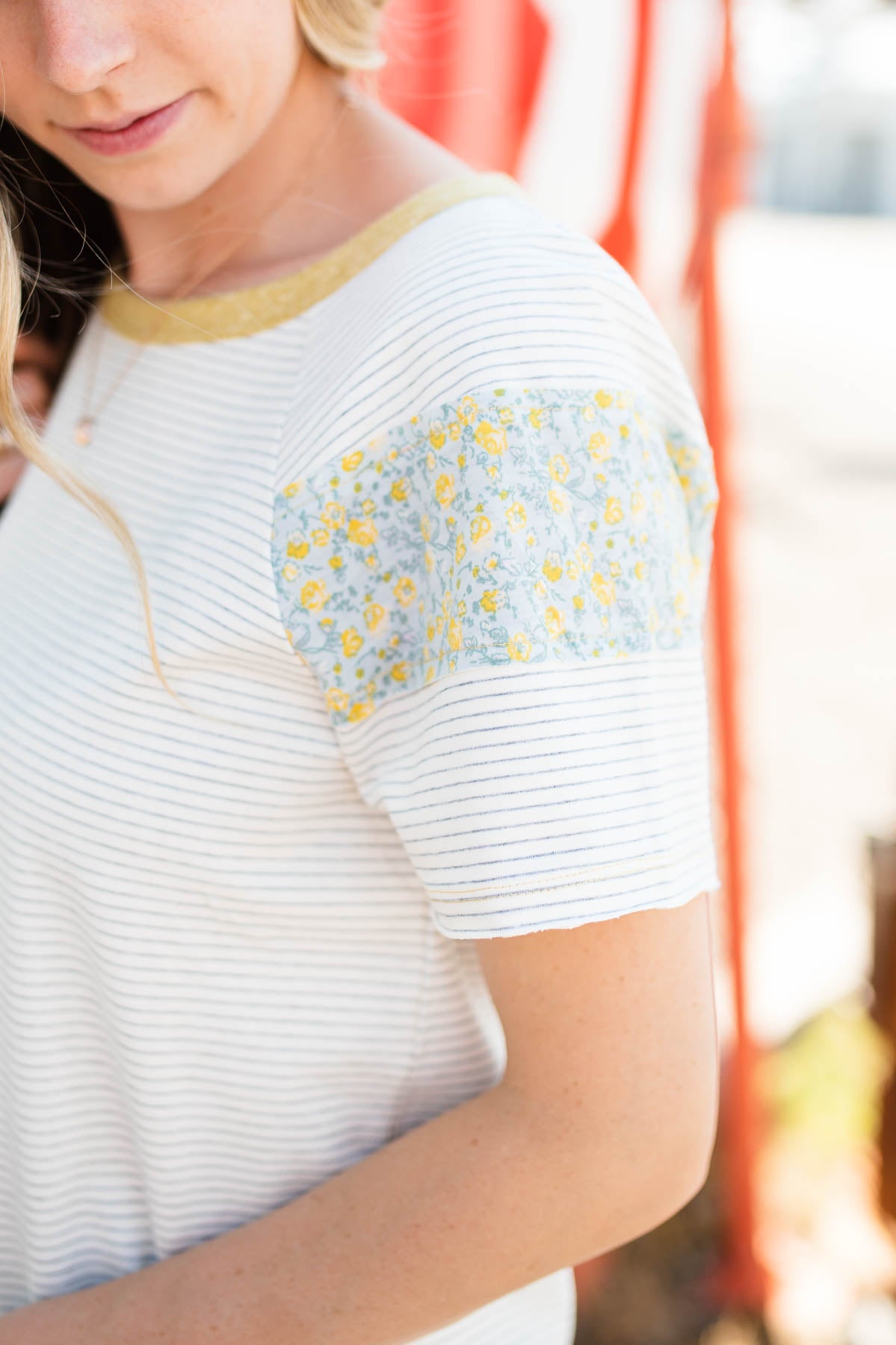 White stripe top with floral pattern on sleeve