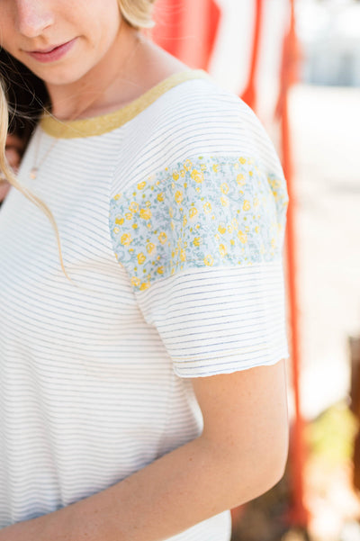 White stripe top with floral pattern on sleeve