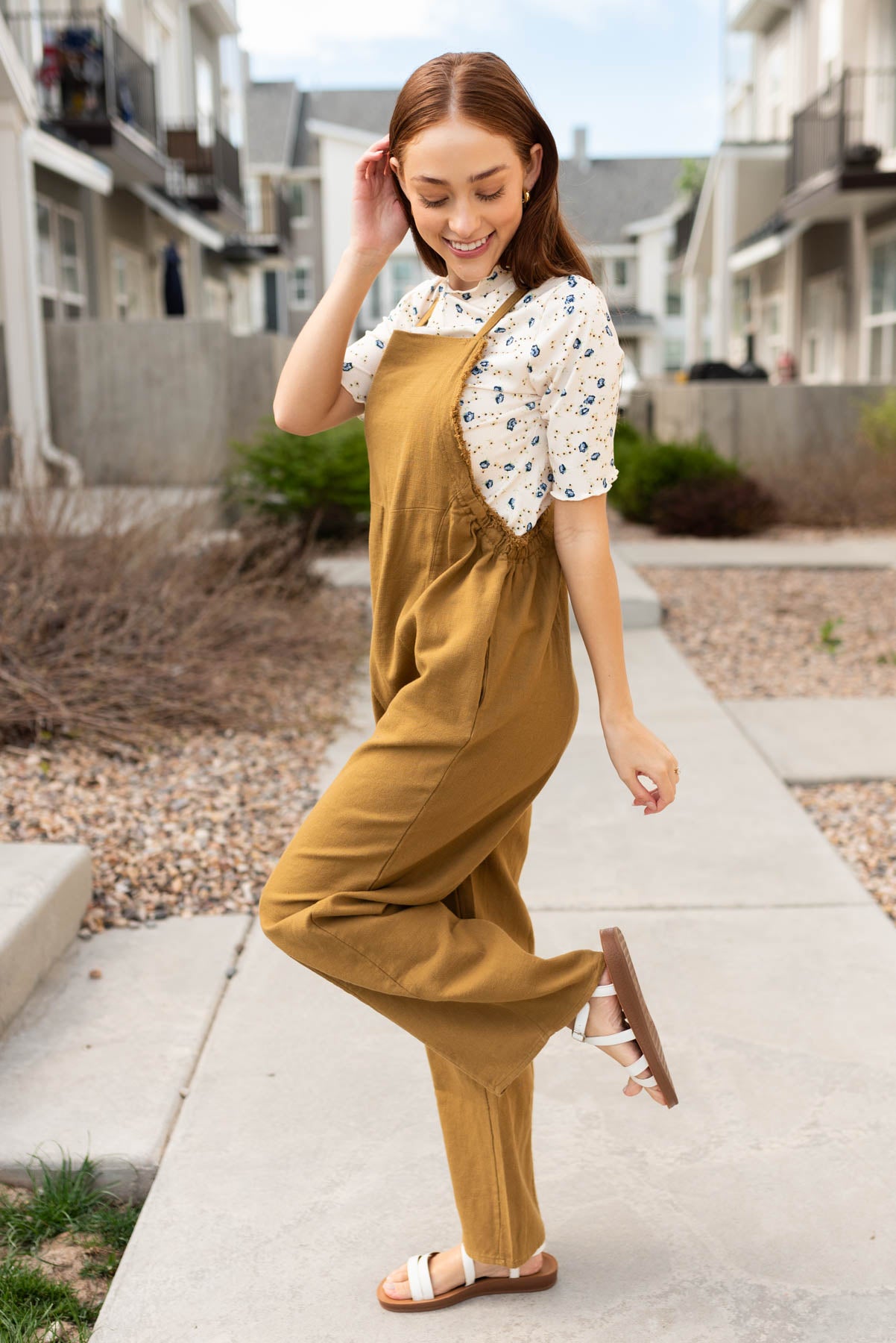 Side view of the dark mustard washed jumpsuit