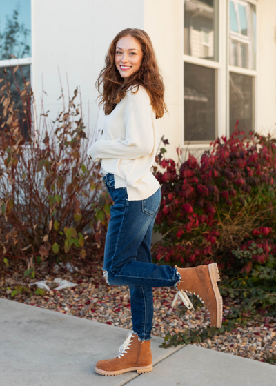 Side view of a heather grey sweater