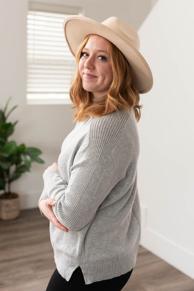 Side view of the heather grey sweater