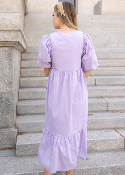 Back view of a short sleeve lavender dress