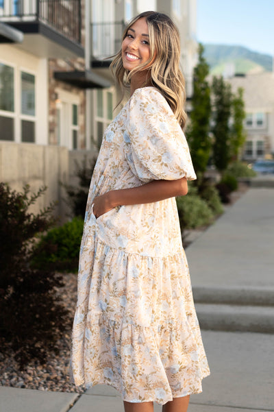 Side view of a vintage blush dress with pockets