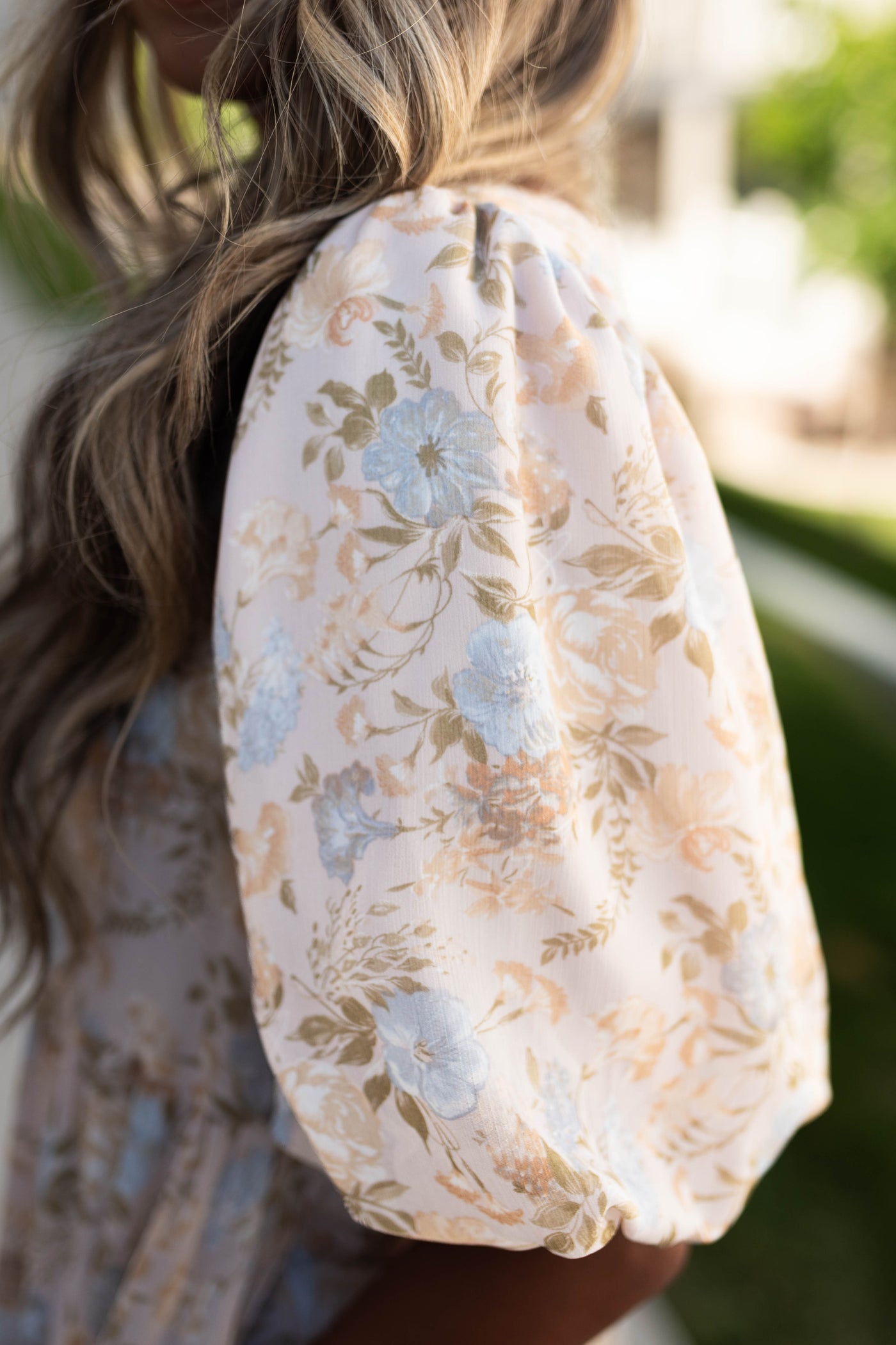 Sleeve of a vintage blush dress