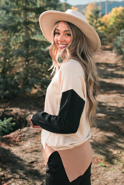 Side view of a light taupe cardigan