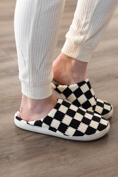 Side view of black checkered slippers