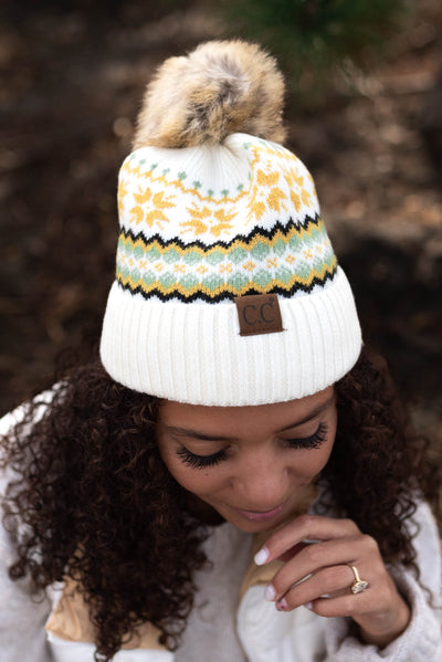 Ivory C.C beanie with puff ball on top