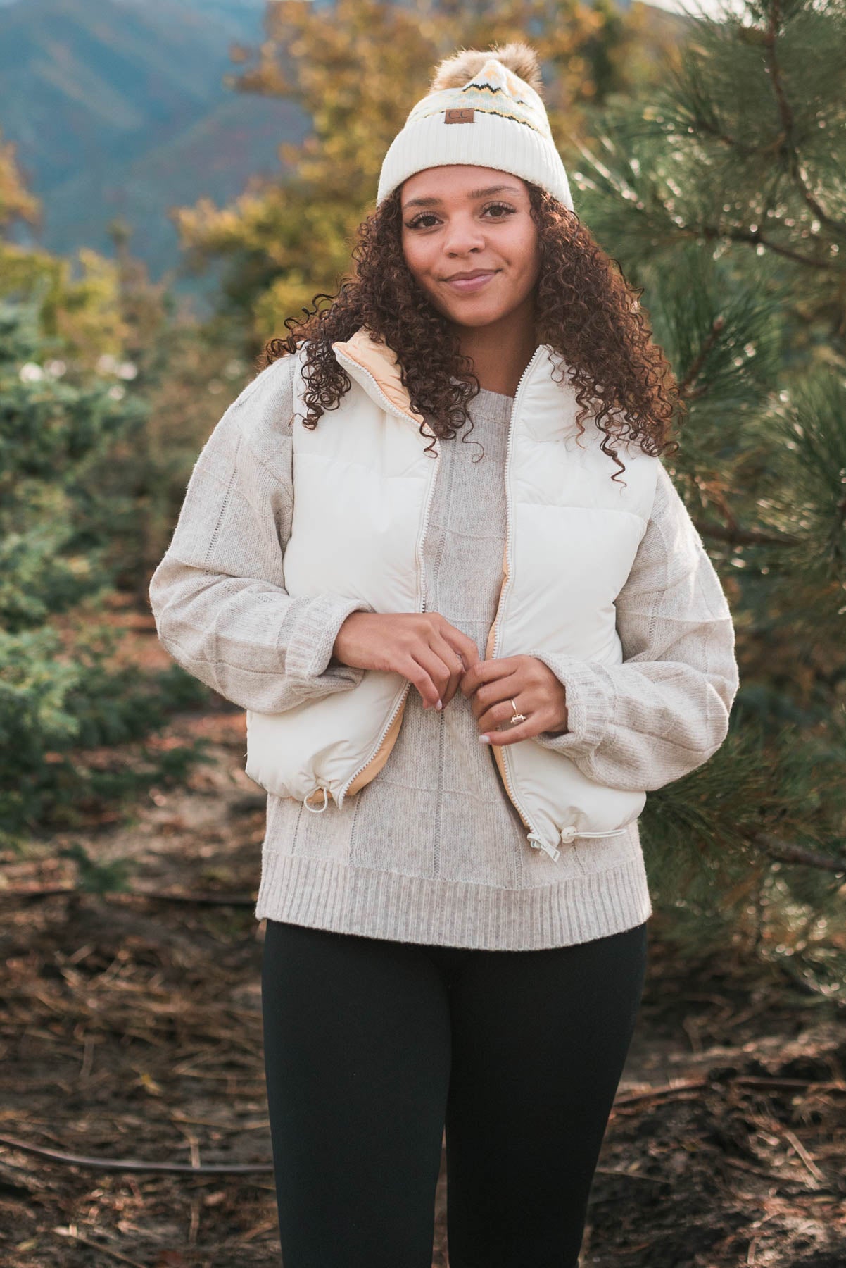 Front view of the ivory reversible puff vest