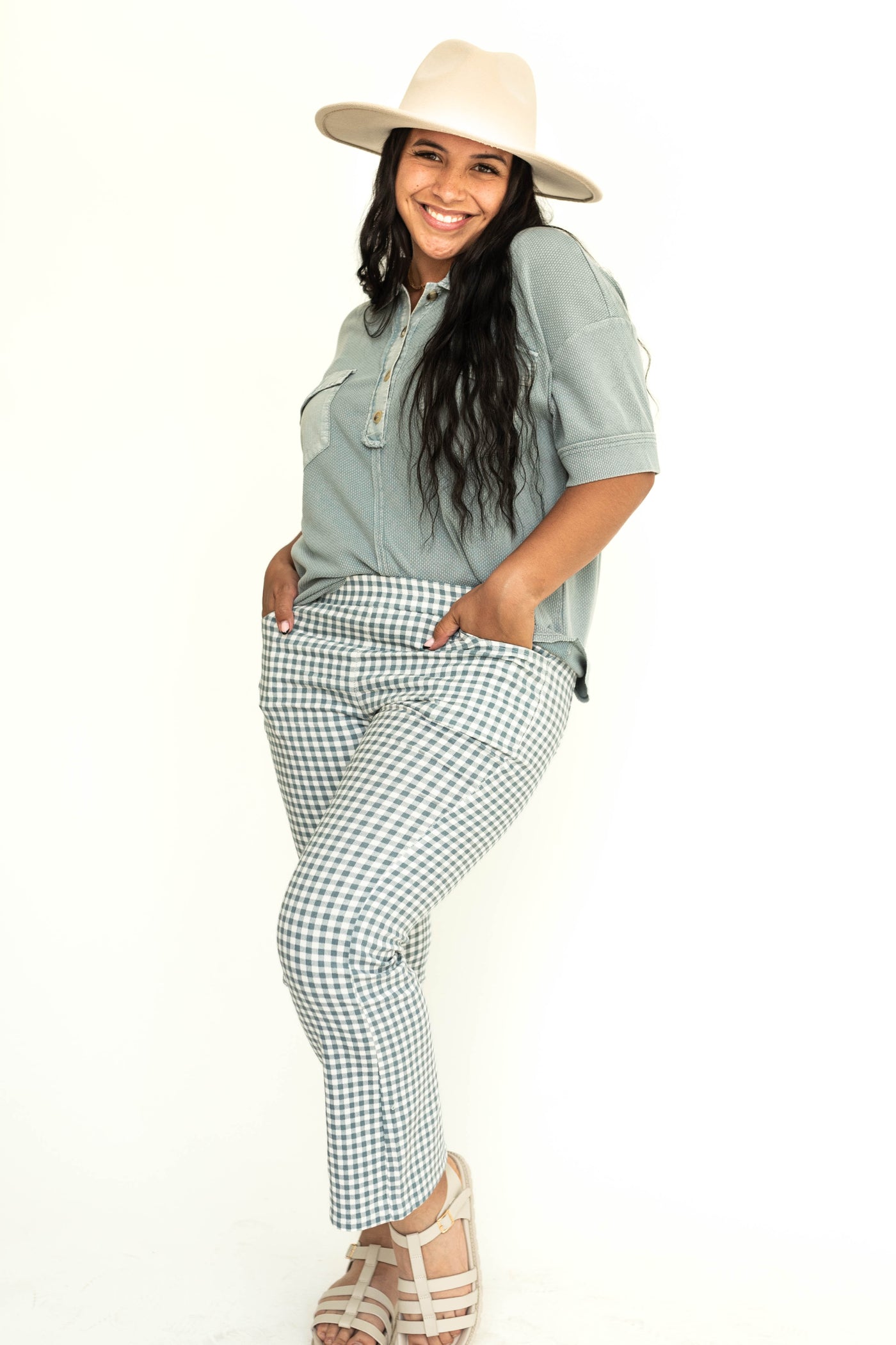 Side view of a ankle length checkered seafoam straight leg pants.