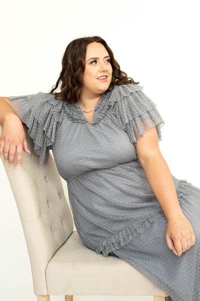 Plus size of a blue gray lace short sleeve dress with ruffles and pockets