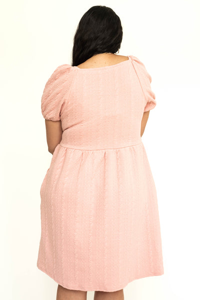 Back view of a dusty pink short sleeve knee length square neck dress.