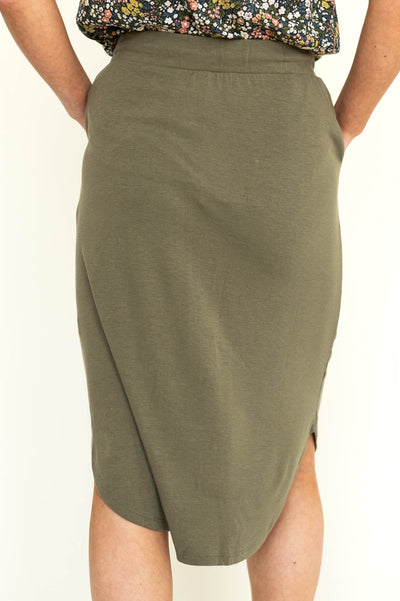 Back view of a knit olive draw string skirt.