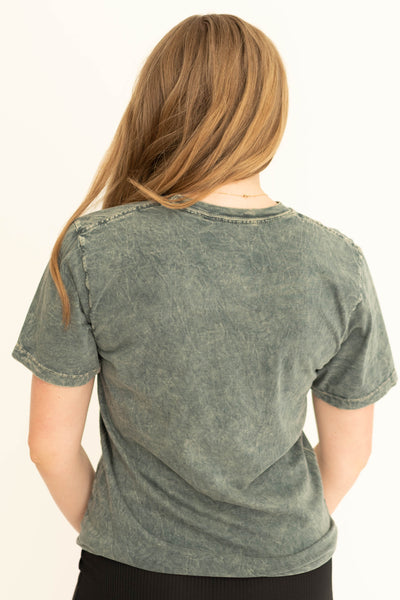 Back view of a stone gray cowboy graphic t-shirt .