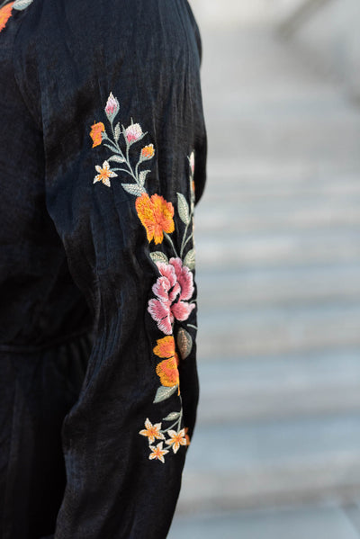 Close up of the embroidery on a black floral dress