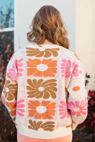 Back view of the cream floral sweater