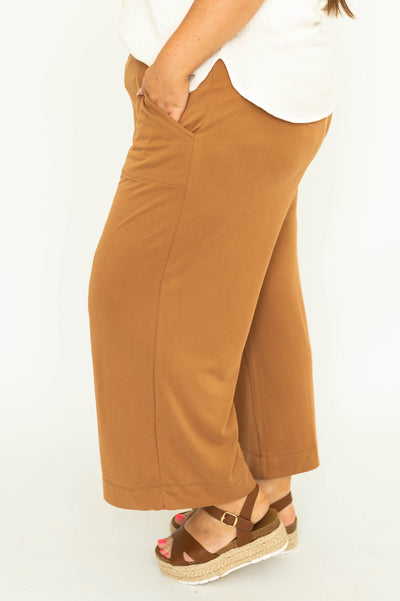 Side view of plus size mocha colored wide leg knit pants.