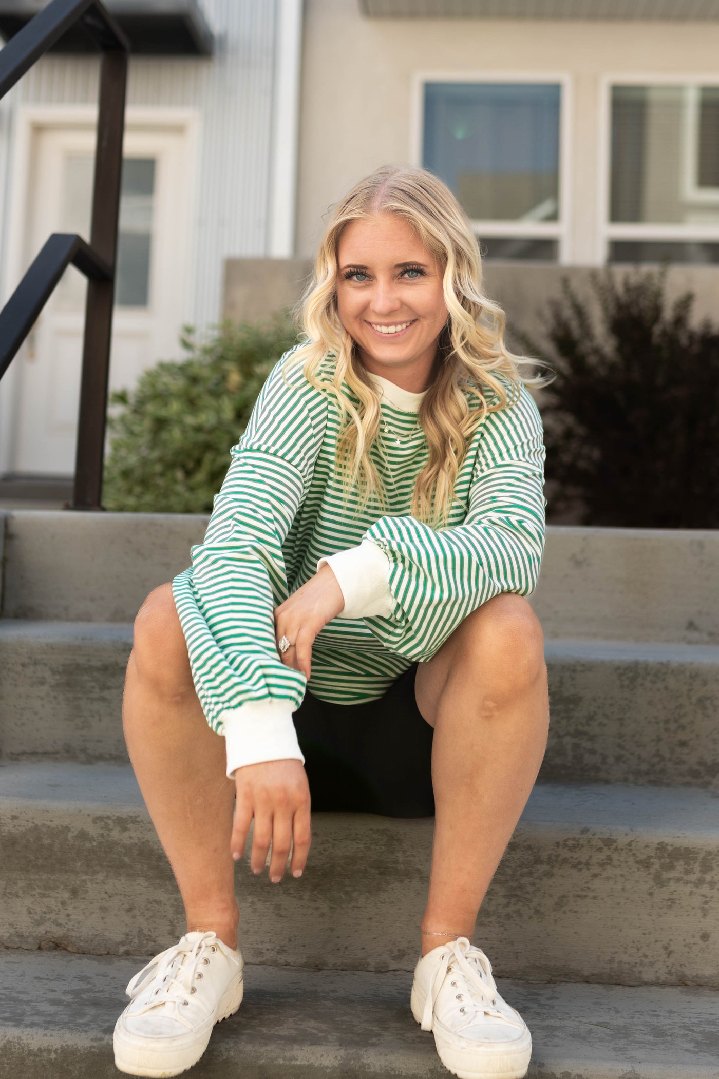 Long sleeve green top with white cuffs
