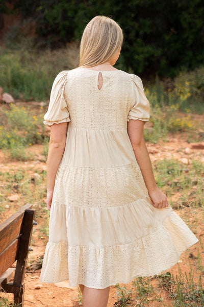 Back view of a beige dress