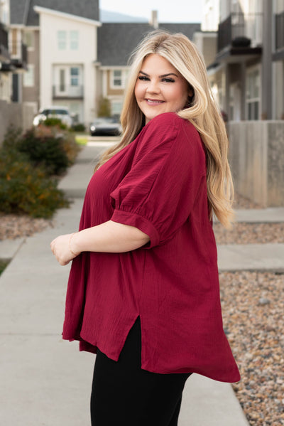 Side view of the plus size burgundy button down