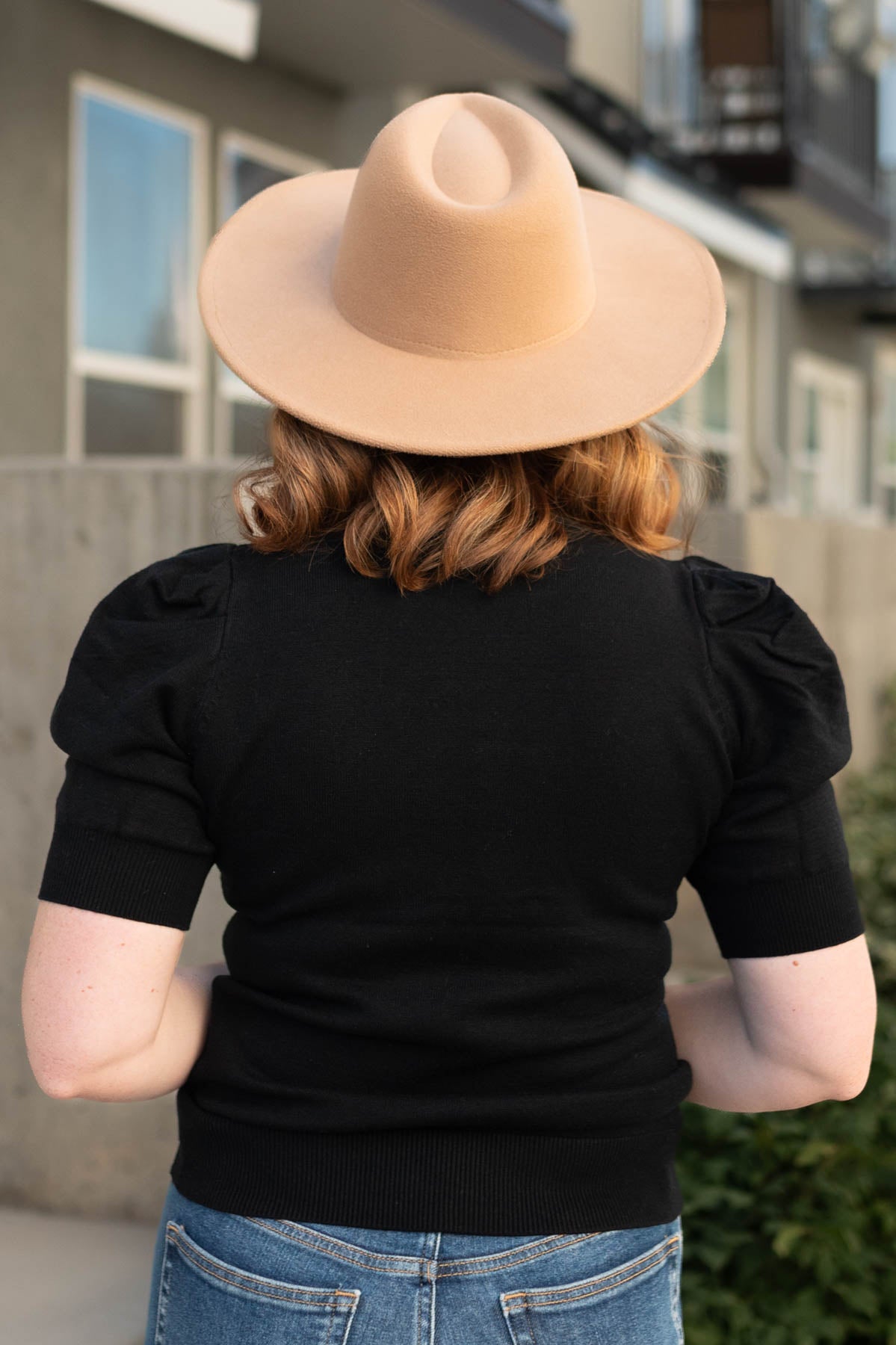 Back view of a short sleeve black top