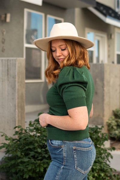 Side view of a dark green top