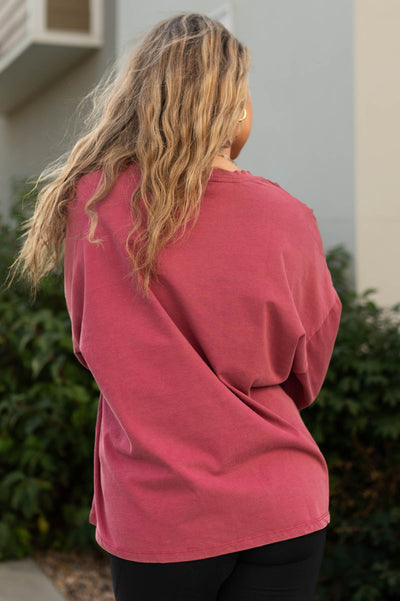 Back view of a magenta pullover