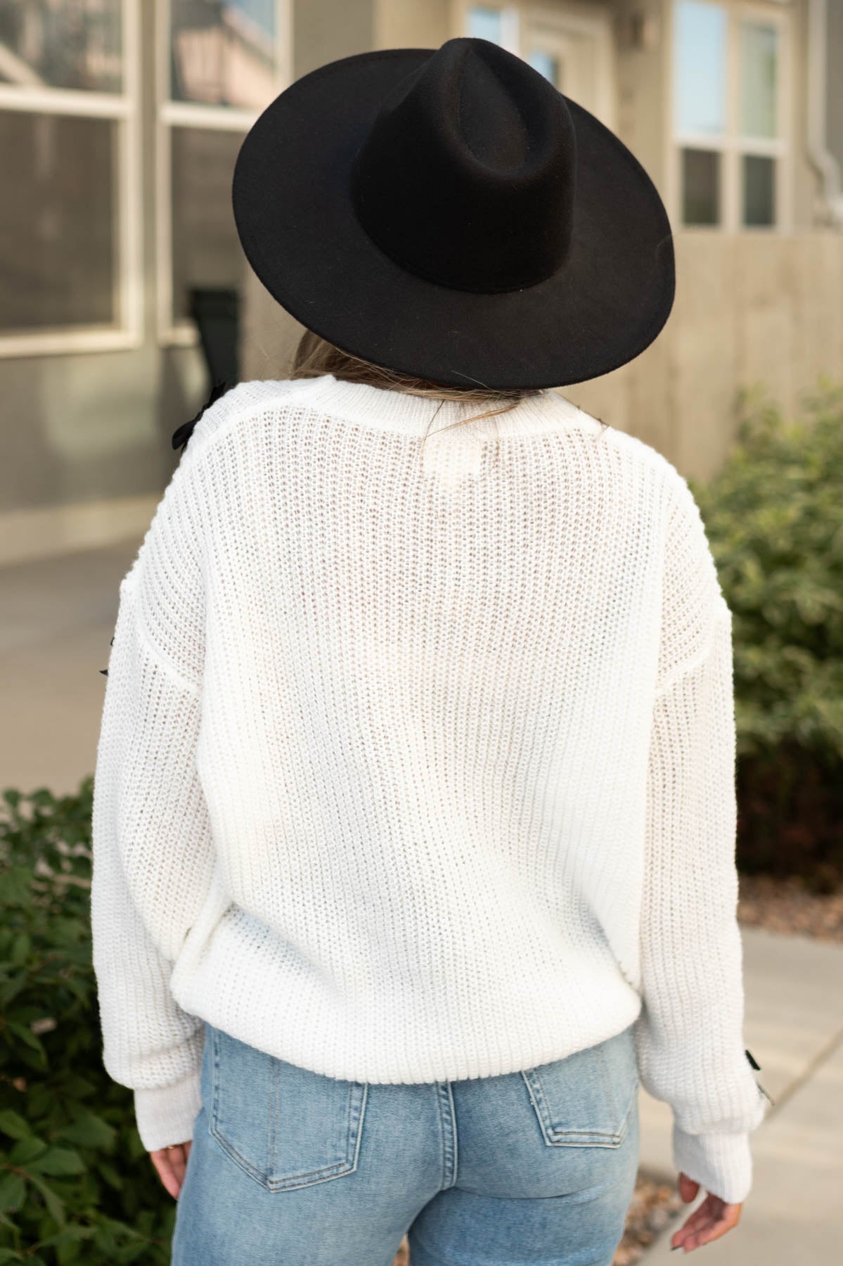 Back view of a white sweater