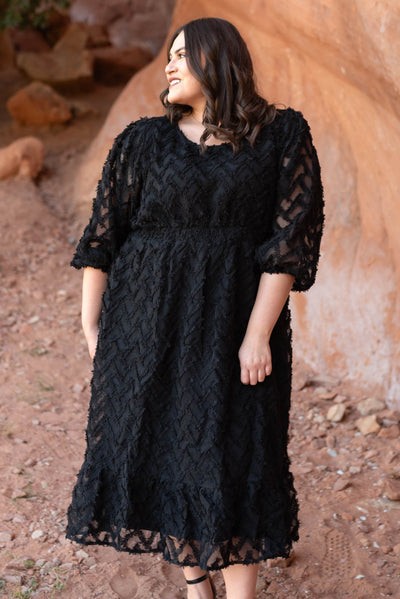 Plus size black dress with elastic waist and sheer sleeve