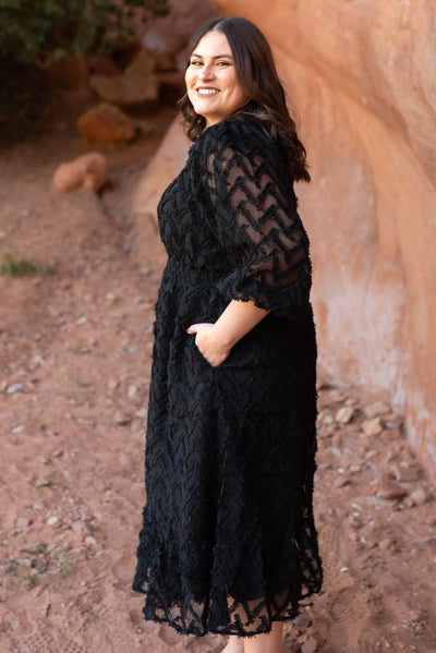 Side view of a plus size black dress