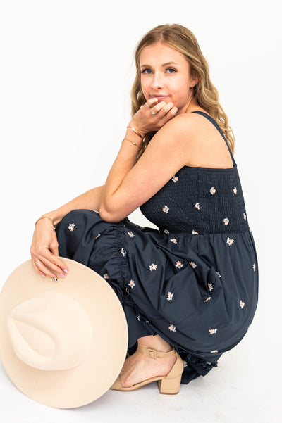 Navy sundress with embordered daisy floral print.