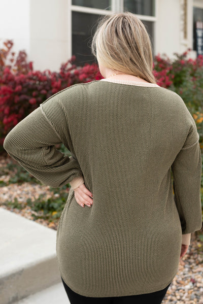 Back view of a plus size olive rib top