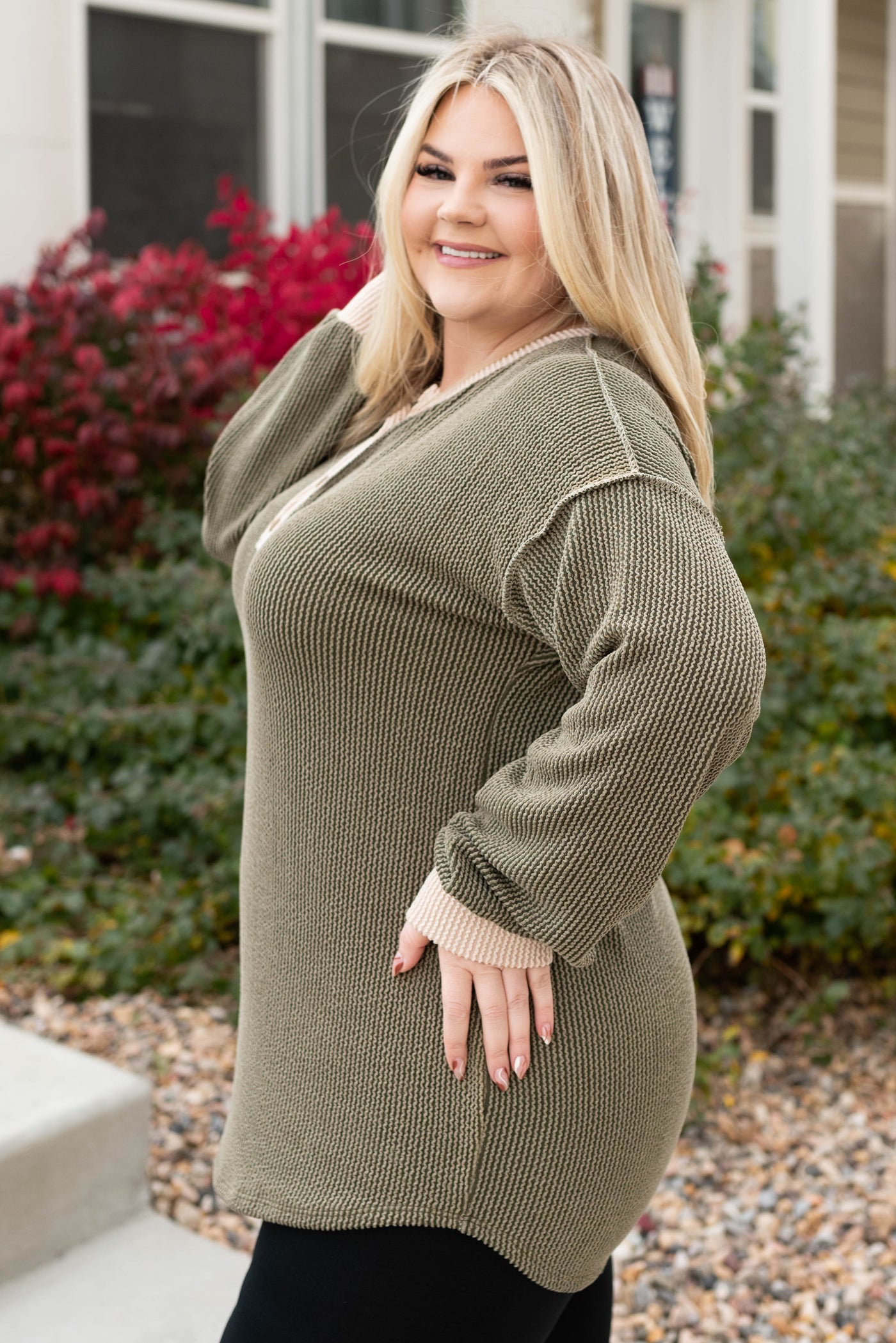 Side view of the plus size olive rib top