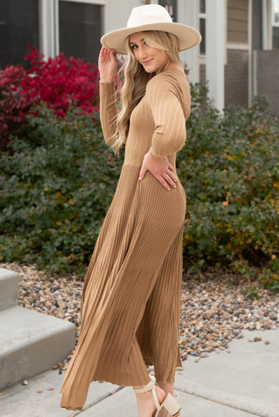 Side view of the latte pleated dress