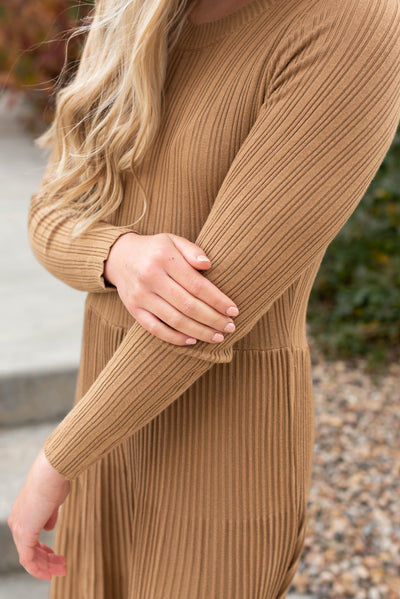Close up of the fabric on the latte pleated dress