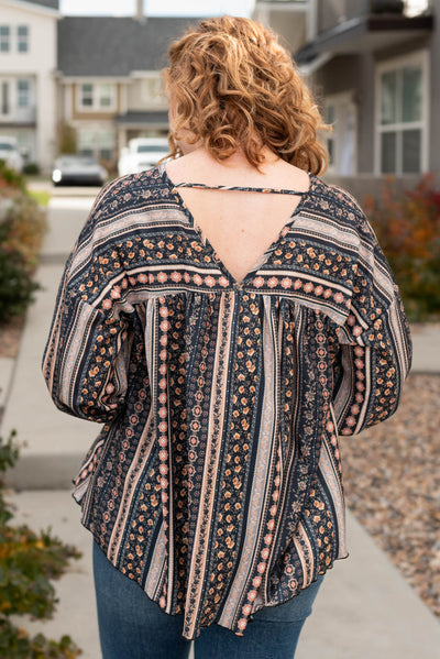 Back view of the black top with V-neck detail