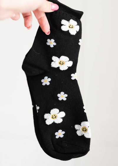 Black flower sock with smiley faces