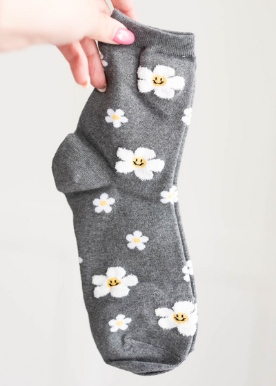 Grey flower socks with smiley faces