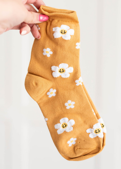 Orange flower socks with smiley faces