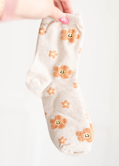 Taupe flower socks with smiley faces