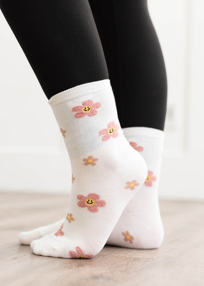 Side view of the white flower socks with smiles